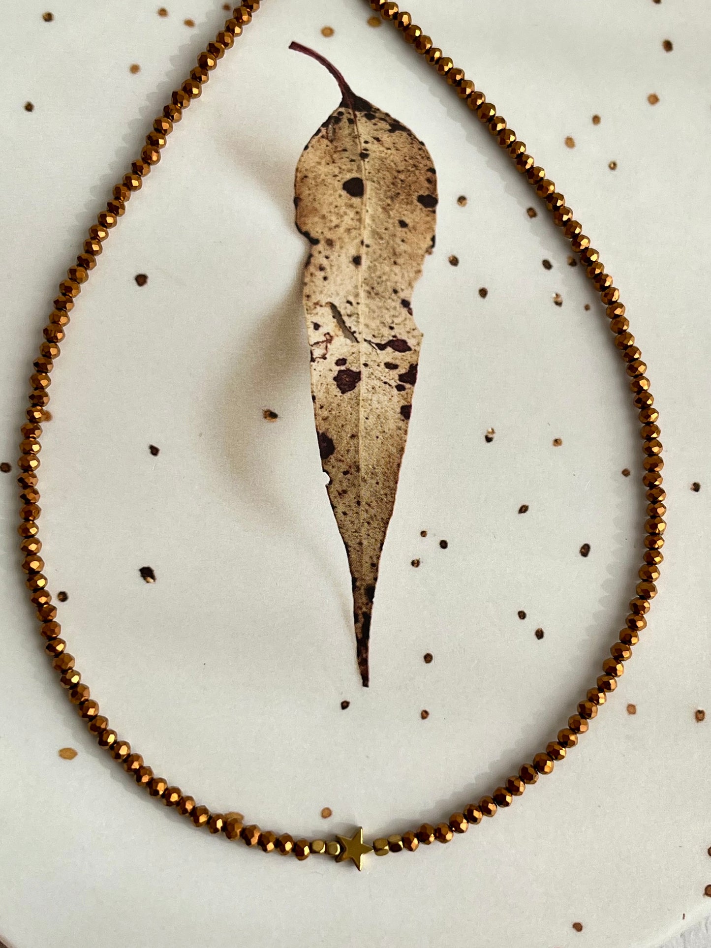 Chocker cristal marrom com estrela